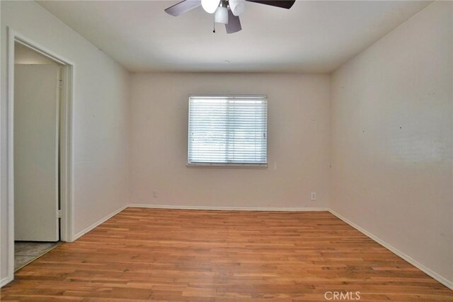 2306 S Encina St, Visalia, CA 93277 - unfurnished room with a ceiling fan, light wood-type flooring, and baseboards