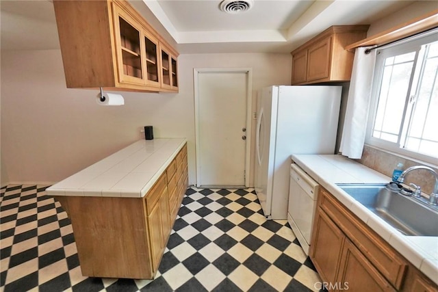 2306 S Encina St, Visalia, CA 93277 - kitchen featuring light floors, dishwasher, tile counters, and a tray ceiling