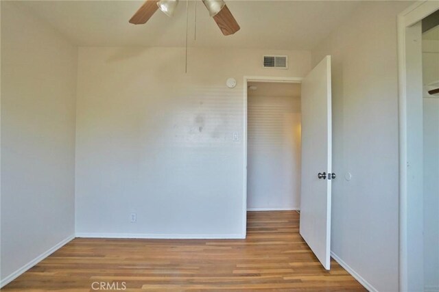 2306 S Encina St, Visalia, CA 93277 - spare room featuring ceiling fan, wood finished floors, and baseboards