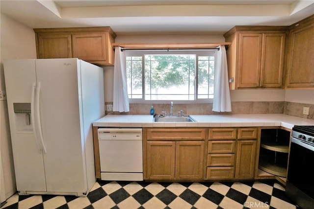 2306 S Encina St, Visalia, CA 93277 - kitchen with white appliances, a sink, light flooring, tile countertops, and a raised ceiling
