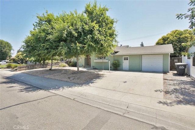 2306 S Encina St, Visalia, CA 93277 - view of front of home featuring a garage, driveway, and stucco siding