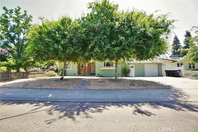 2306 S Encina St, Visalia, CA 93277 - obstructed view of property with concrete driveway, stucco siding, and an attached garage