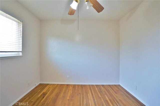 2306 S Encina St, Visalia, CA 93277 - spare room featuring ceiling fan, wood finished floors, and baseboards