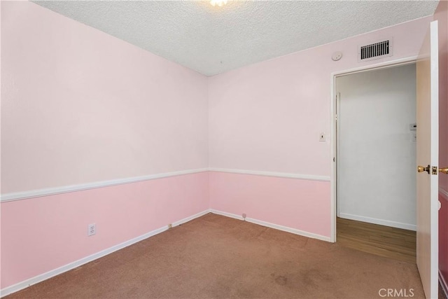 11747 Hollyview Dr, La Mirada, CA 90638 - carpeted empty room with a textured ceiling and baseboards