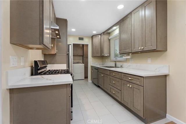 11747 Hollyview Dr, La Mirada, CA 90638 - kitchen featuring washer / dryer, appliances with stainless steel finishes, a sink, recessed lighting, and under cabinet range hood