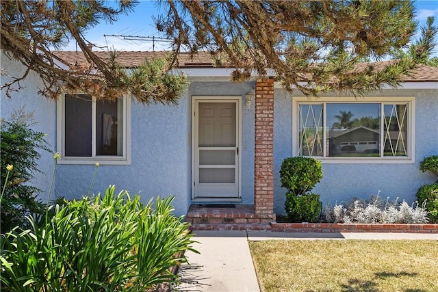 11747 Hollyview Dr, La Mirada, CA 90638 - property entrance with stucco siding and a yard