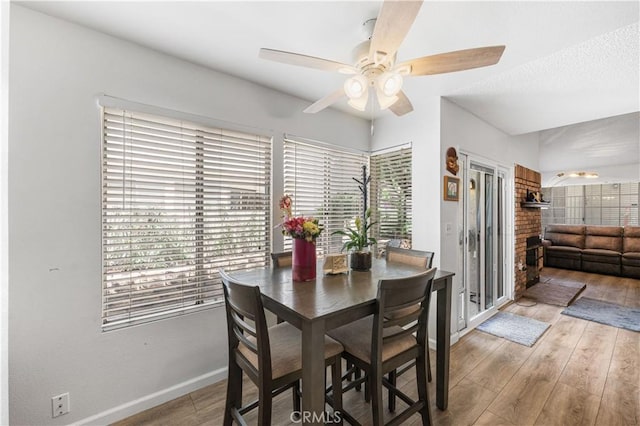 37940 42nd St E Unit 115, Palmdale, CA 93552 - dining room with plenty of natural light, a ceiling fan, light wood-style floors, and baseboards