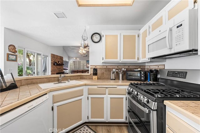 37940 42nd St E Unit 115, Palmdale, CA 93552 - kitchen featuring white appliances, a sink, ceiling fan, and tile countertops
