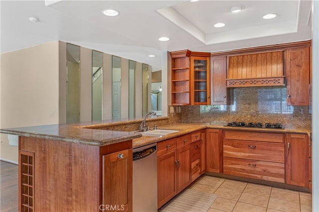 25455 Hardy Pl, Stevenson Ranch, CA 91381 - kitchen featuring stainless steel dishwasher, brown cabinetry, a sink, dark stone counters, and a peninsula