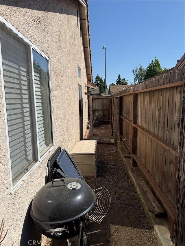 1438 Tumbleweed Ct, Oakdale, CA 95361 - view of property exterior featuring stucco siding and a fenced backyard