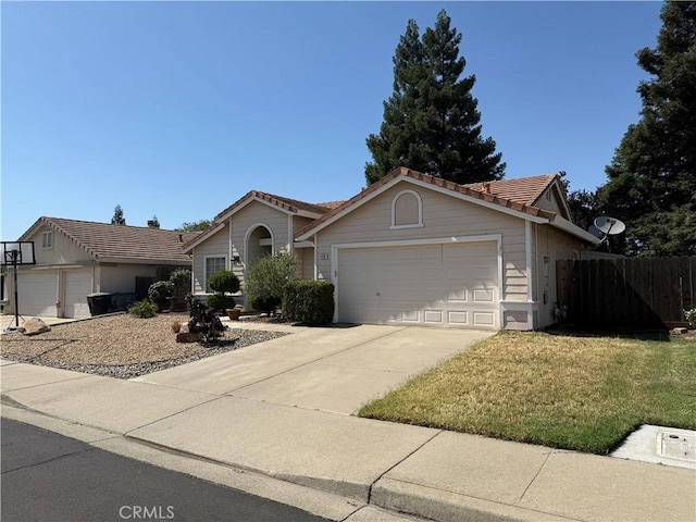 1438 Tumbleweed Ct, Oakdale, CA 95361 - ranch-style home with a garage, a tile roof, and concrete driveway
