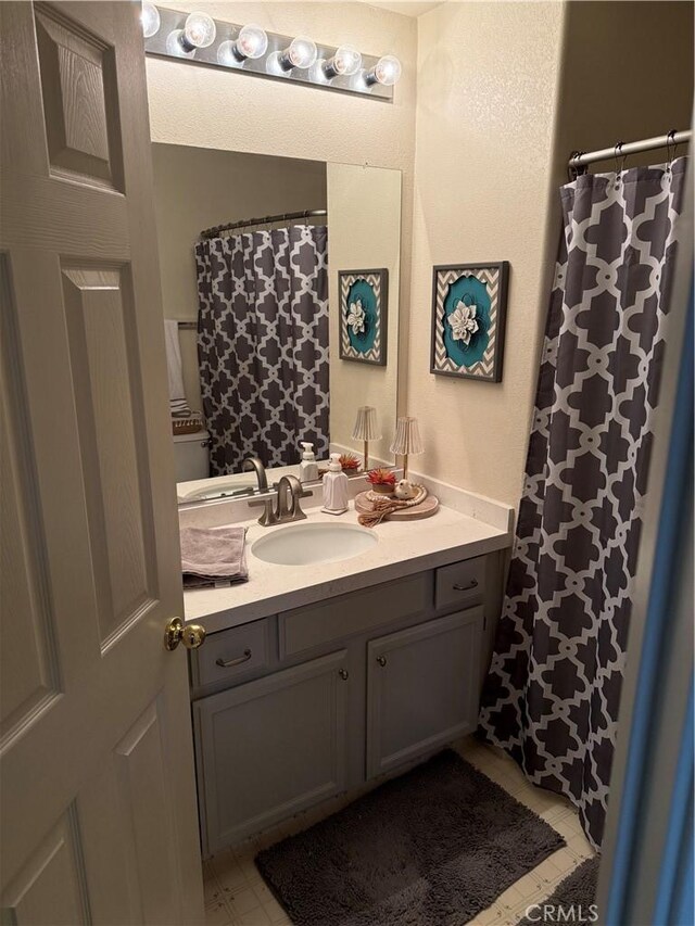 1438 Tumbleweed Ct, Oakdale, CA 95361 - bathroom featuring vanity and a shower with curtain