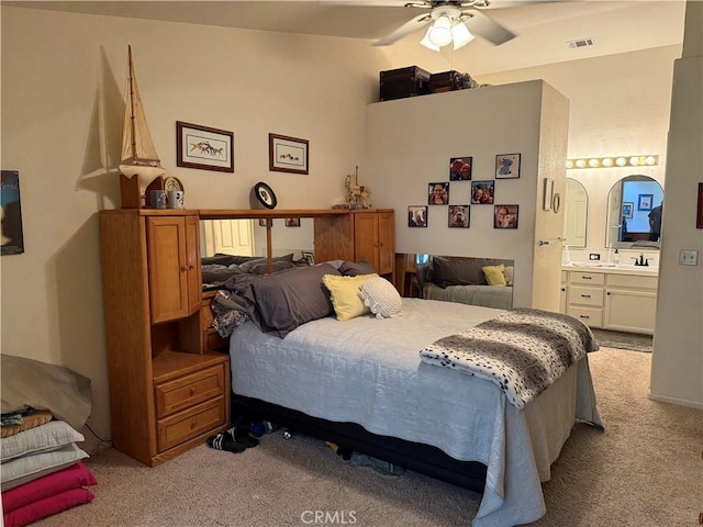 1438 Tumbleweed Ct, Oakdale, CA 95361 - bedroom featuring light colored carpet, lofted ceiling, ensuite bath, a sink, and a ceiling fan