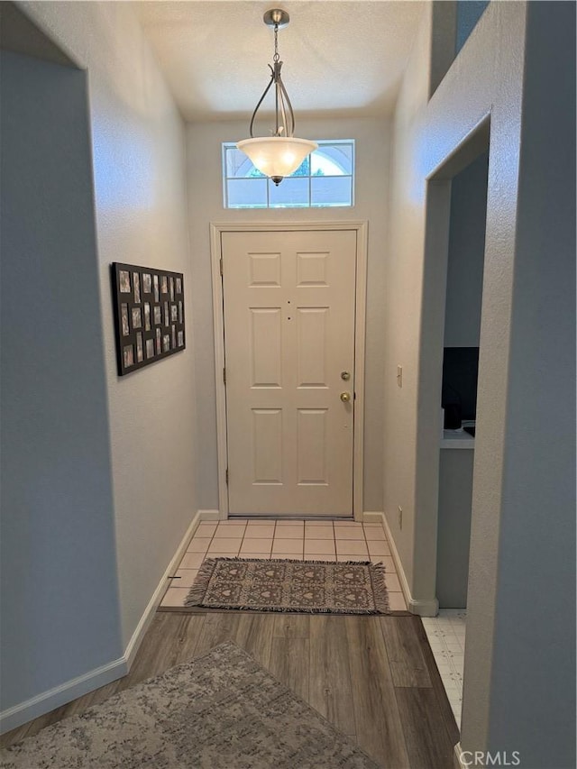 1438 Tumbleweed Ct, Oakdale, CA 95361 - doorway with light wood-type flooring and baseboards