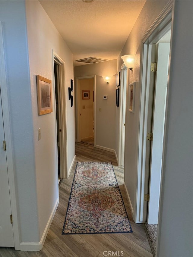 1438 Tumbleweed Ct, Oakdale, CA 95361 - hall with wood finished floors and baseboards