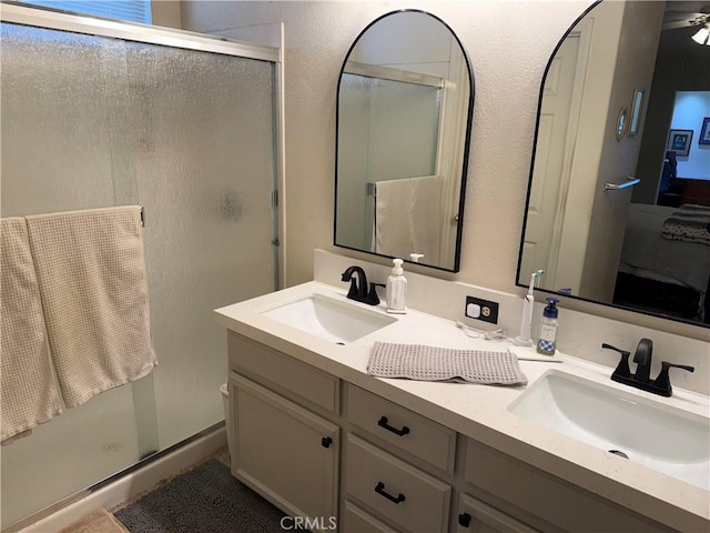 1438 Tumbleweed Ct, Oakdale, CA 95361 - bathroom with double vanity and a stall shower