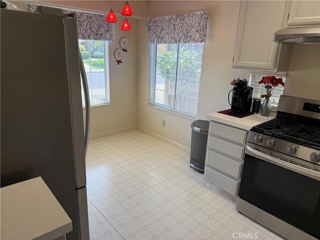 1438 Tumbleweed Ct, Oakdale, CA 95361 - kitchen featuring stainless steel appliances, light flooring, under cabinet range hood, light countertops, and baseboards