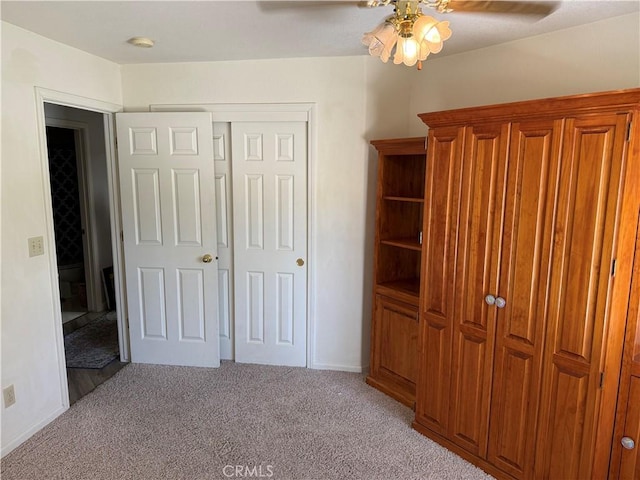 1438 Tumbleweed Ct, Oakdale, CA 95361 - unfurnished bedroom featuring light colored carpet, a closet, ceiling fan, and baseboards