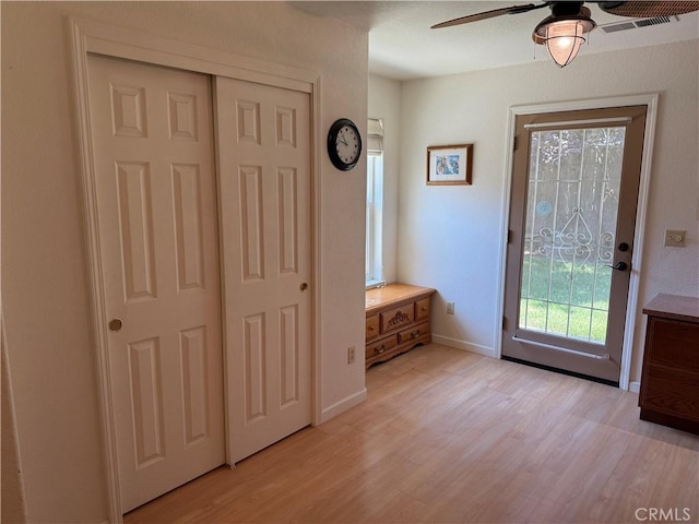 1438 Tumbleweed Ct, Oakdale, CA 95361 - entryway with ceiling fan, light wood-style floors, and baseboards