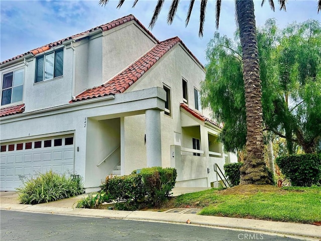 2 Vista Del Mar, Dana Point, CA 92629 - mediterranean / spanish-style house with a tiled roof, a garage, and stucco siding