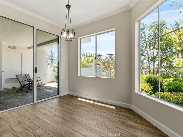 2 Vista Del Mar, Dana Point, CA 92629 - unfurnished room with crown molding, wood finished floors, plenty of natural light, and a chandelier