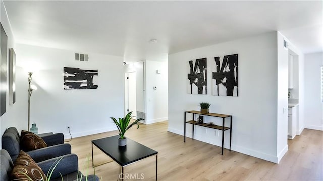 23331 Caminito Basilio Unit 348, Laguna Hills, CA 92653 - living room with light wood finished floors and baseboards