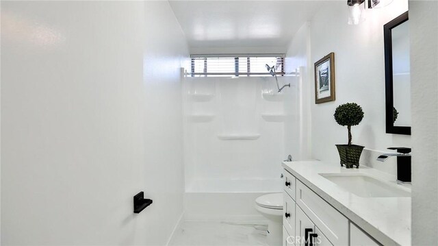 23331 Caminito Basilio Unit 348, Laguna Hills, CA 92653 - full bathroom featuring vanity, toilet, marble look tile flooring, shower / bathtub combination, and baseboards