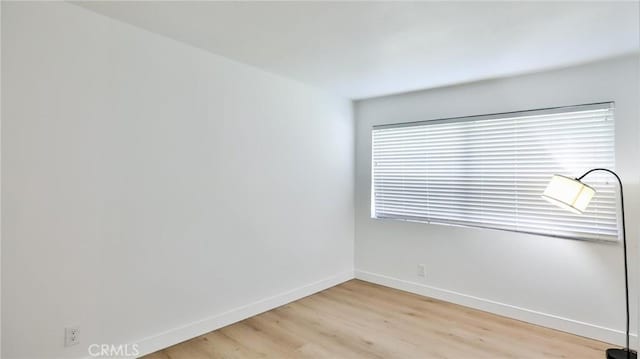 23331 Caminito Basilio Unit 348, Laguna Hills, CA 92653 - unfurnished room with light wood-type flooring and baseboards