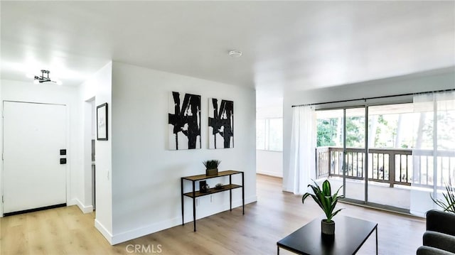 23331 Caminito Basilio Unit 348, Laguna Hills, CA 92653 - living area featuring wood finished floors and baseboards
