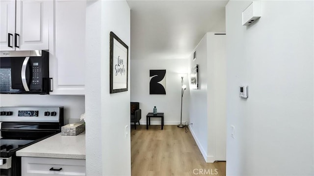 23331 Caminito Basilio Unit 348, Laguna Hills, CA 92653 - hall with light wood-style flooring and baseboards