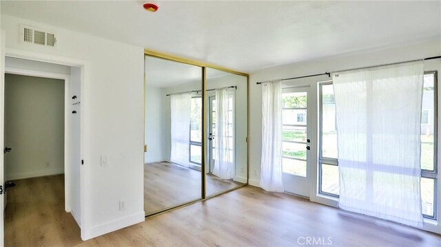 23331 Caminito Basilio Unit 348, Laguna Hills, CA 92653 - entryway featuring wood finished floors and baseboards