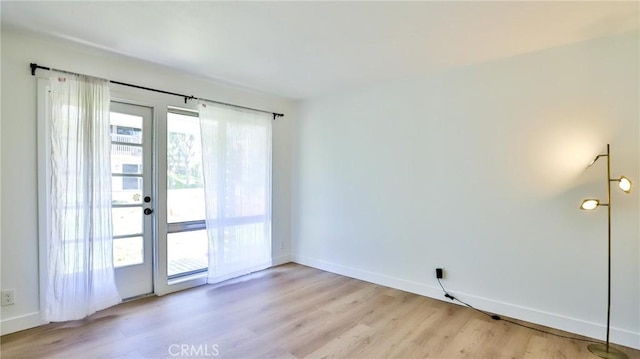 23331 Caminito Basilio Unit 348, Laguna Hills, CA 92653 - empty room with light wood-style floors and baseboards