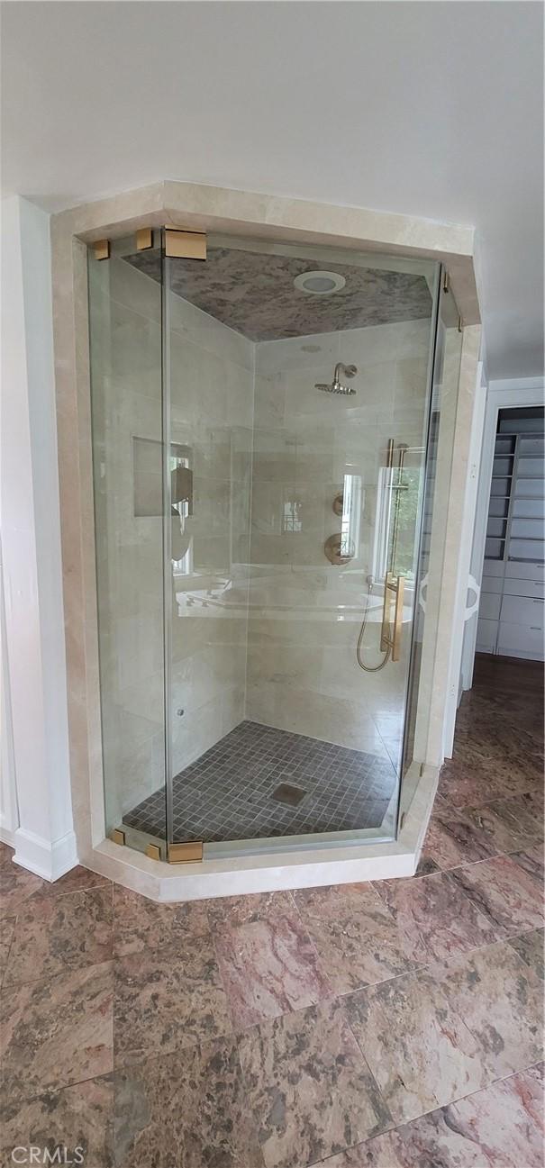 448 N Oakhurst Dr Unit 1, Beverly Hills, CA 90210 - full bath with a shower stall and baseboards