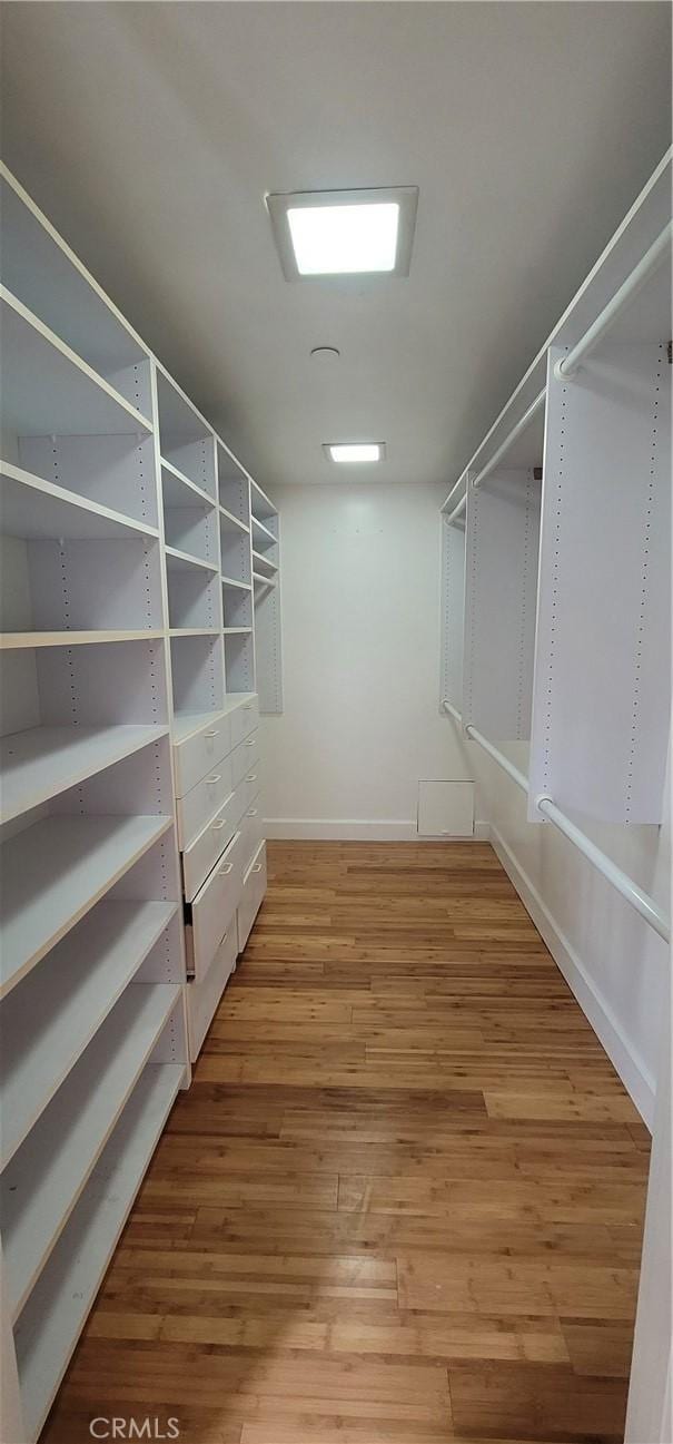 448 N Oakhurst Dr Unit 1, Beverly Hills, CA 90210 - spacious closet featuring wood finished floors