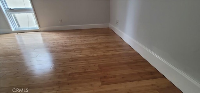 448 N Oakhurst Dr Unit 1, Beverly Hills, CA 90210 - spare room with wood finished floors and baseboards