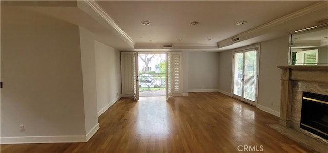 448 N Oakhurst Dr Unit 1, Beverly Hills, CA 90210 - unfurnished living room with a premium fireplace, healthy amount of natural light, baseboards, wood finished floors, and crown molding