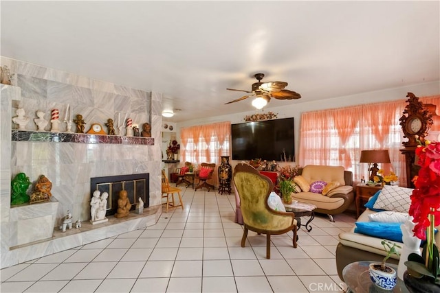 1140 Indian Summer Ave, La Puente, CA 91744 - living area featuring a ceiling fan, tile patterned flooring, and a tiled fireplace