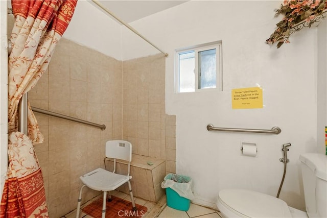 1140 Indian Summer Ave, La Puente, CA 91744 - bathroom featuring toilet, tiled shower, and tile patterned flooring