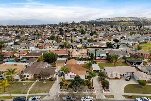 1140 Indian Summer Ave, La Puente, CA 91744 - aerial view of property and surrounding area featuring nearby suburban area and a mountain backdrop