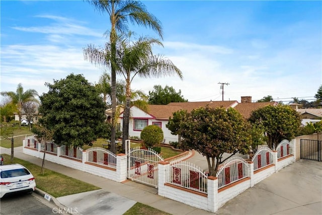 1140 Indian Summer Ave, La Puente, CA 91744 - view of property hidden behind natural elements with a fenced front yard and a gate
