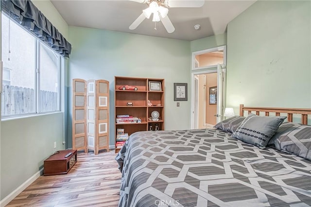 2737 Sussex Ave, Clovis, CA 93611 - bedroom with light wood-style flooring, baseboards, and a ceiling fan