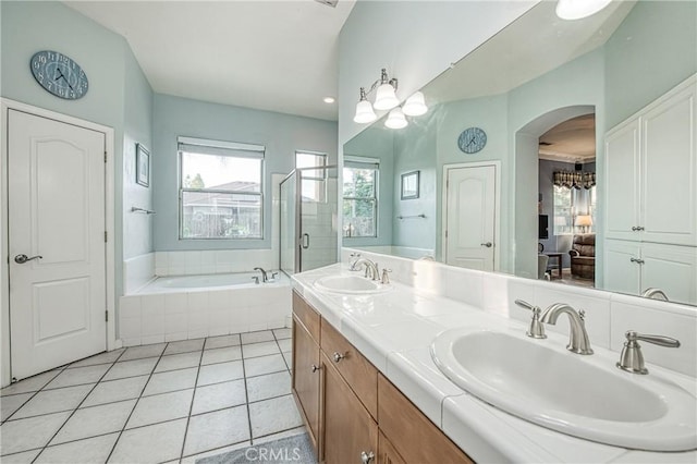 2737 Sussex Ave, Clovis, CA 93611 - ensuite bathroom with a garden tub, double vanity, and tile patterned flooring