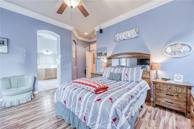 2737 Sussex Ave, Clovis, CA 93611 - bedroom with wood finished floors, ornamental molding, arched walkways, ceiling fan, and ensuite bath