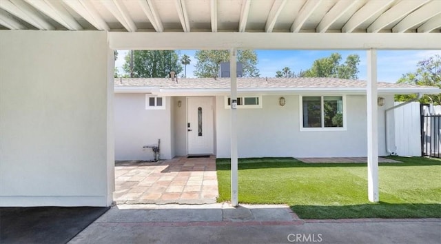 19842 Gilmore St, Woodland Hills, CA 91367 - view of front of property featuring stucco siding and a patio area