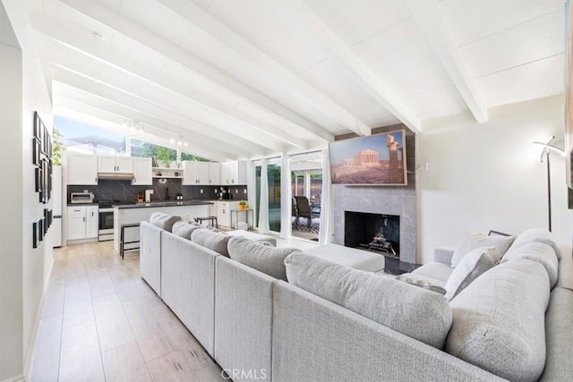19842 Gilmore St, Woodland Hills, CA 91367 - living room featuring healthy amount of natural light and a fireplace