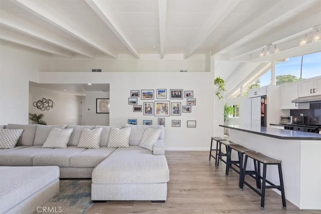 19842 Gilmore St, Woodland Hills, CA 91367 - living room featuring beamed ceiling and light wood-type flooring