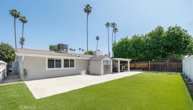 19842 Gilmore St, Woodland Hills, CA 91367 - back of house featuring a fenced backyard, a patio area, an outdoor structure, and stucco siding