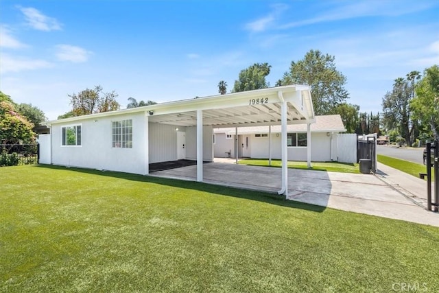 19842 Gilmore St, Woodland Hills, CA 91367 - back of property featuring driveway and a carport