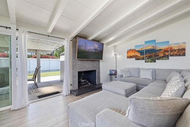 19842 Gilmore St, Woodland Hills, CA 91367 - living room featuring a tile fireplace and wood finished floors
