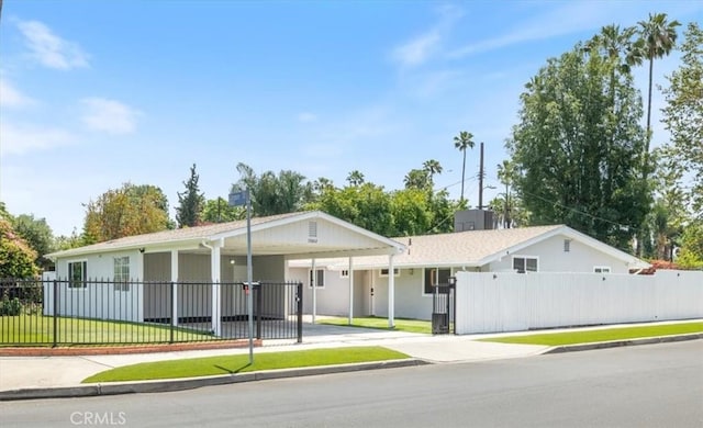 19842 Gilmore St, Woodland Hills, CA 91367 - ranch-style home with driveway and a carport